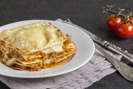 Meat lasagna on a wooden background.
の写真素材