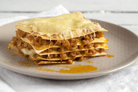 Meat lasagna on a wooden background.
の写真素材