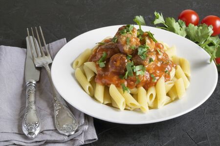 meat meatballs with Penne in tomato sauce.の写真素材