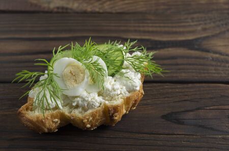 Croissant with cheese and herbs. on dark background
の写真素材