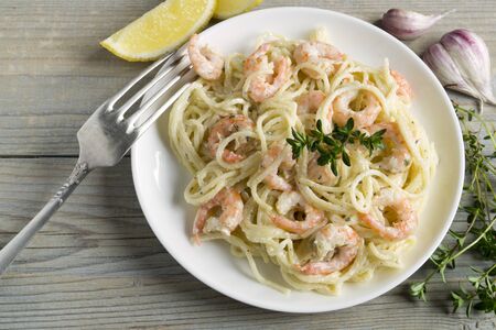 spaghetti with prawns in cream sauce. traditional Italian cuisine.の写真素材
