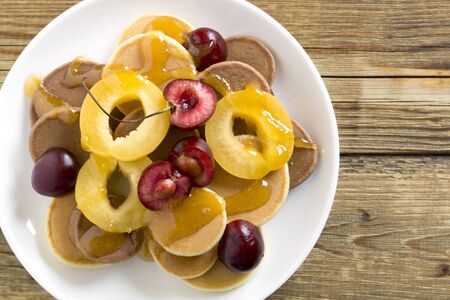 mini pancakes. small pancakes with berries for Breakfast.の写真素材
