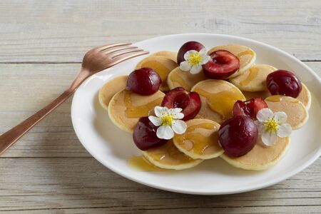 mini pancakes. small pancakes with berries for Breakfast.の写真素材
