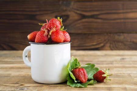ripe fresh strawberries. berry harvest on a wooden backgroundの写真素材