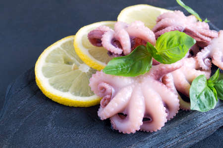 Seafood. pickled baby octopus with lemon. tasty snack.の写真素材