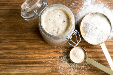 Active rye sourdough in a glass jar for homemade bread.の写真素材