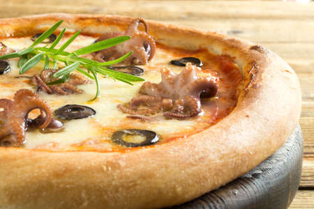Traditional Italian dish, delicious pizza with seafoodの写真素材