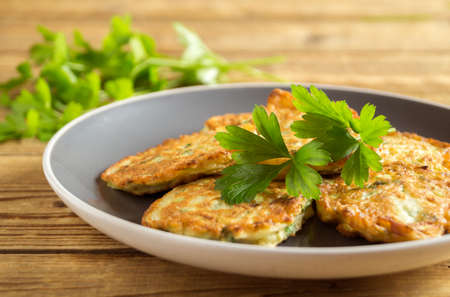 vegetarian healthy zucchini pancakes with herbs and sour creamの写真素材