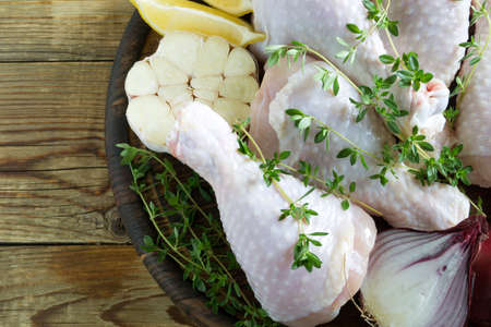 raw chicken legs with spices. ingredients for cooking.の写真素材