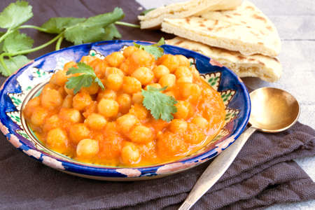 Turkish chickpeas stewed in spicy sauce. Oriental dish.の写真素材