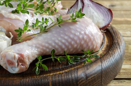 raw chicken legs with spices. ingredients for cooking.の写真素材