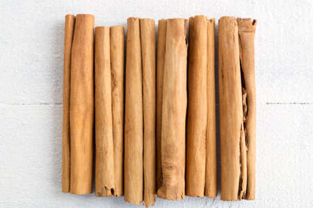 Fragrant sticks of Ceylon cinnamon on white background.