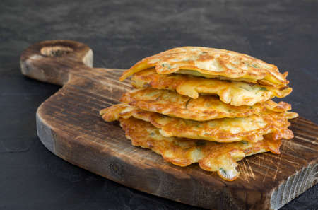 vegetarian healthy zucchini pancakes with herbs and sour creamの写真素材