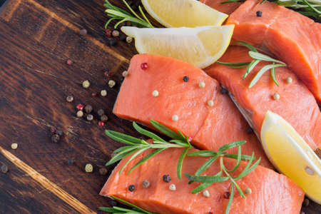raw Atlantic salmon fillet. on a wooden cutting Board.の写真素材