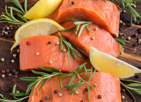 raw Atlantic salmon fillet. on a wooden cutting Board.の写真素材