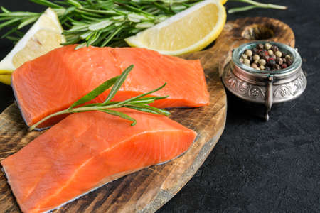 raw Atlantic salmon fillet. on a wooden cutting Board.の写真素材