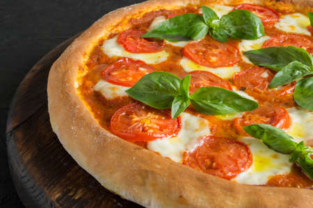 Italian pizza Margarita. with tomato sauce and mozzarella cheeseの写真素材