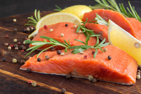 raw Atlantic salmon fillet. on a wooden cutting Board.の写真素材