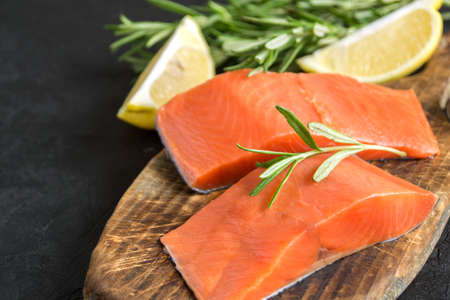 raw Atlantic salmon fillet. on a wooden cutting Board.の写真素材