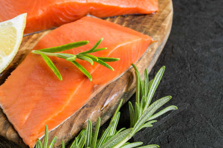 raw Atlantic salmon fillet. on a wooden cutting Board.の写真素材