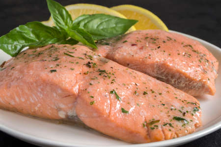 cooked salmon with spices. on a white plateの写真素材