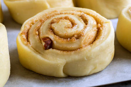 Cinnabon. homemade cinnamon rolls. raw rolls on a baking sheetの写真素材