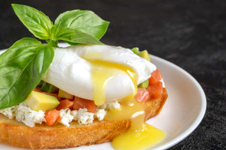 poached egg on healthy bread with avocado. healthy breakfastの写真素材