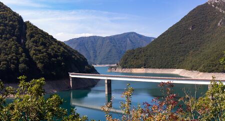 Bridge over the Piva lake azure color on a sunny dayの写真素材
