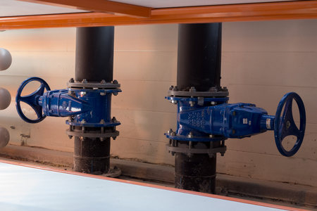 A large pipeline heating faucet blue on black pipe