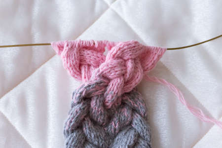 grey pink gradient knit on the needles by hand from wool