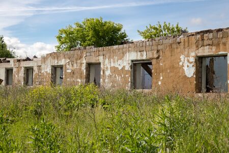 An old abandoned building without a roof in the village near the Ural, Russia.の写真素材