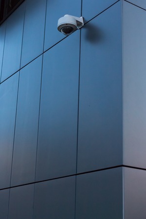 Security camera on dark modern building
