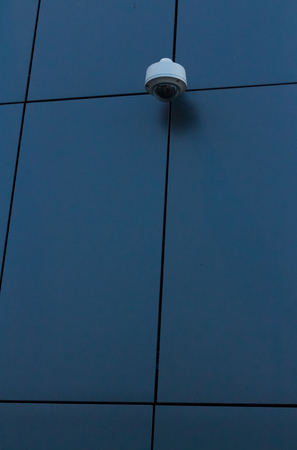 Security camera on dark modern building