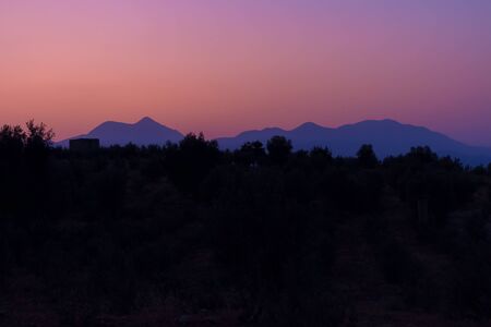 beauty pink sunset and silhouettes of mountains. Turkeyの写真素材