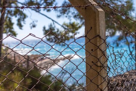 Beautiful and Blur Blue Sea View back of fence.の写真素材
