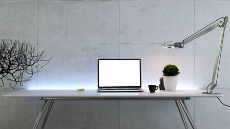 Work space stand mock up with table and plant, laptop, cup; sticker, table lamp front view concrete wall 3D renderingの写真素材