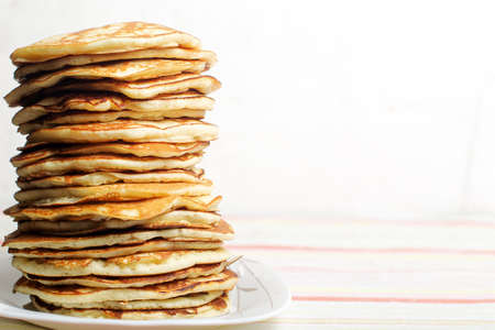 High stack of pancakes . Breakfast for the whole family . With copy space. Shallow DOFの写真素材