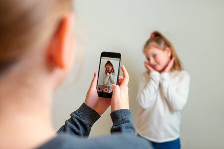 Teens record video on camera for blog.