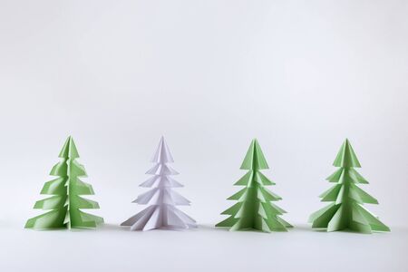 Christmas concept. Origami paper green Christmas trees.の写真素材