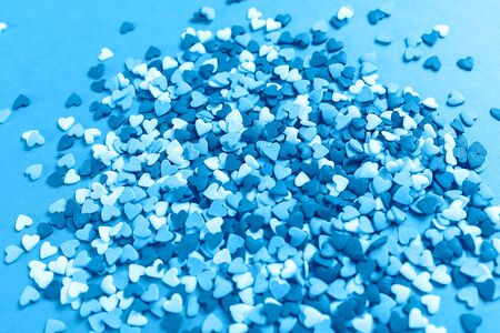 Lots of multicolored hearts on pink background for Valentine's dayの写真素材