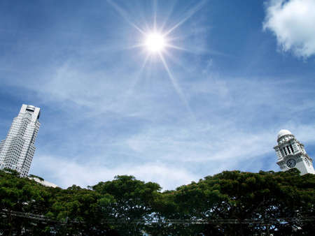 victoria clock tower and tower,sky and sun, singaporeの写真素材