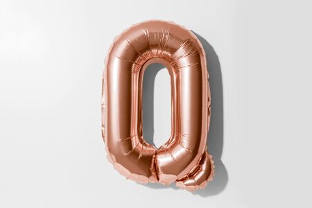 Letter Q, Rose gold foil balloon alphabet isolated on a white background with Clipping Pathの写真素材