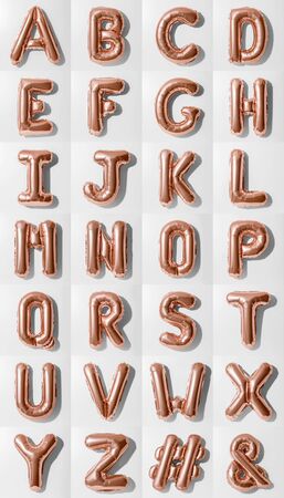 Set of letters A-Z # &, Rose gold foil balloon alphabet with hashtag and ampersand symbol isolated on white backgroundの写真素材