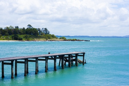Wood bridge go on to the seaの写真素材