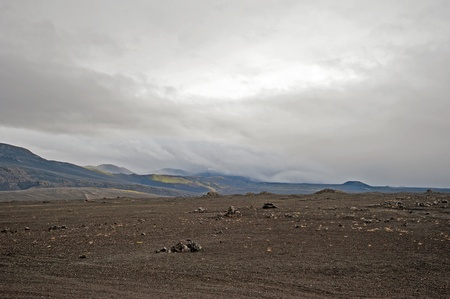 The southern Iceland, one of the most active volcanoes, Hekla, hides under a blanket of cloudsの写真素材
