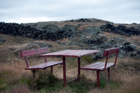 The north-eastern Iceland, pause table and wooden bench in the lava field at Lake Myvatn