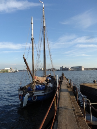Amsterdam, old pier with sailing ship near the NDSM wharf, facing towards the railway station...