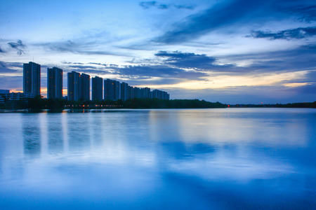 city scape at night with reflection on lake. Thailand. sunset with sky. small lake in city.の写真素材