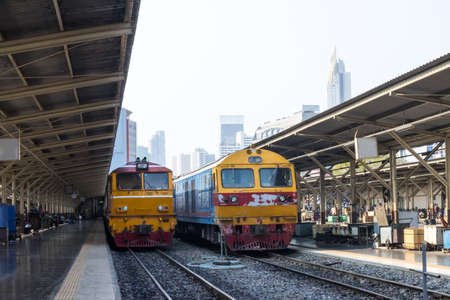 vintage train. diesel locomotive train stop at public station. old railway station with trains and...
