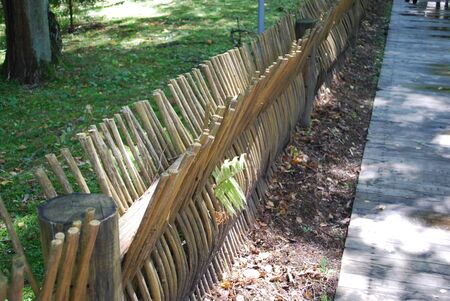Vintage fence, fence, palisade with your own handsの写真素材